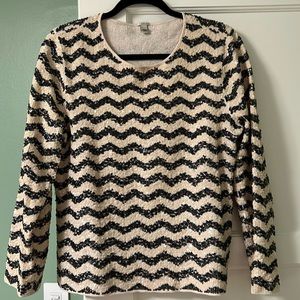 Sequence detailed black and ivory colored top.  Perfect for special occasions